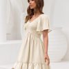 Women's Flowy Casual Mini Dresses 2025 Summer Graduation Smocked V Neck Vacation Dress Dress with Pockets